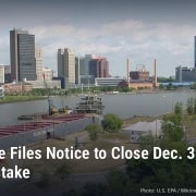 Downtown Toledo skyline along the Maumee River, with headline: The Blade Files Notice to Close Dec. 31; 116 Jobs at Stake